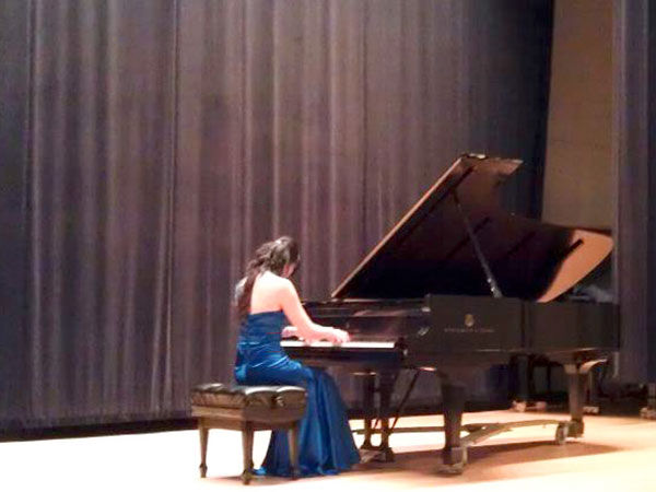 Yoonjoo performing at the piano